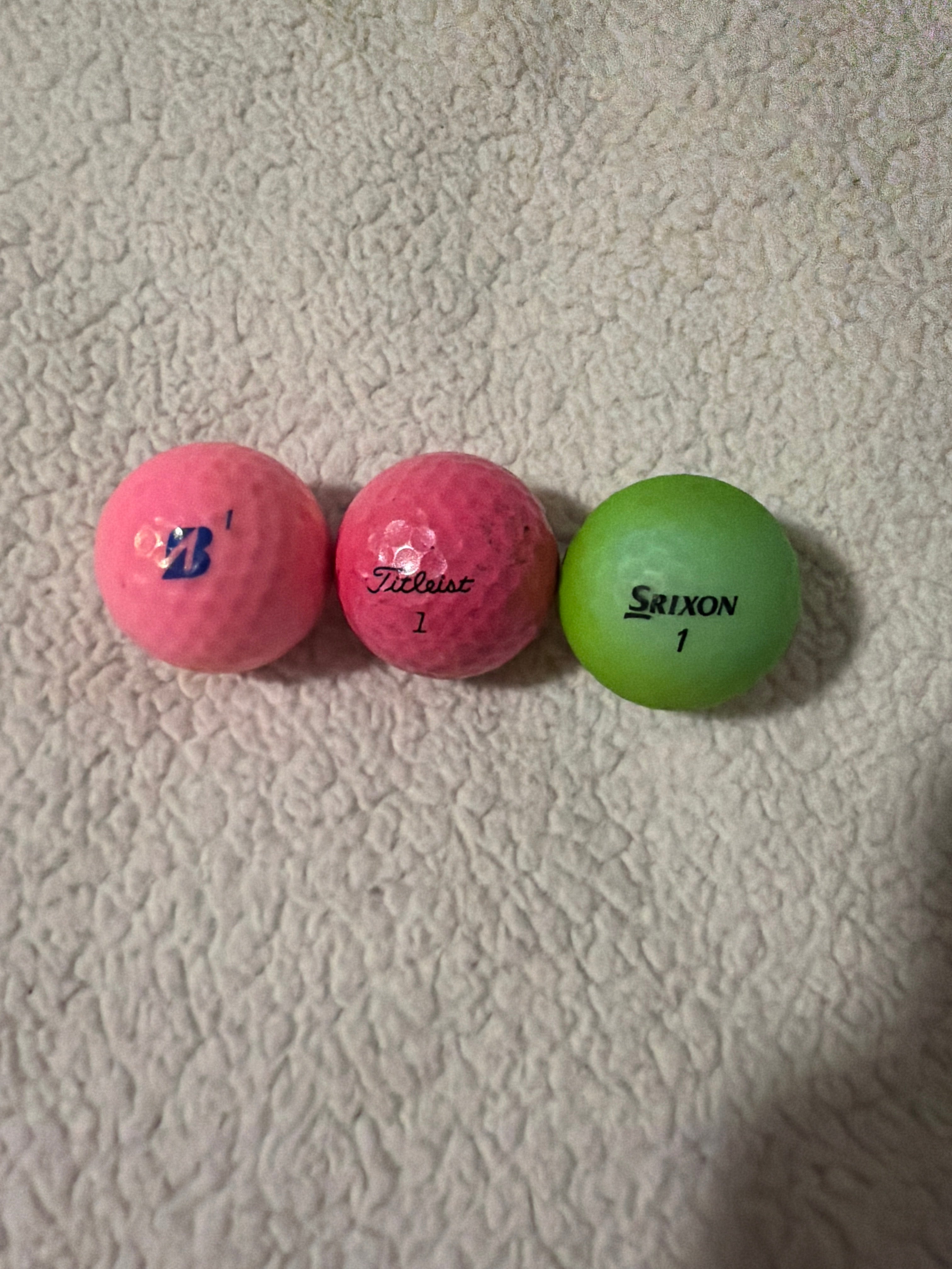Dozen colored golf balls ￼