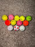 Dozen colored golf balls ￼