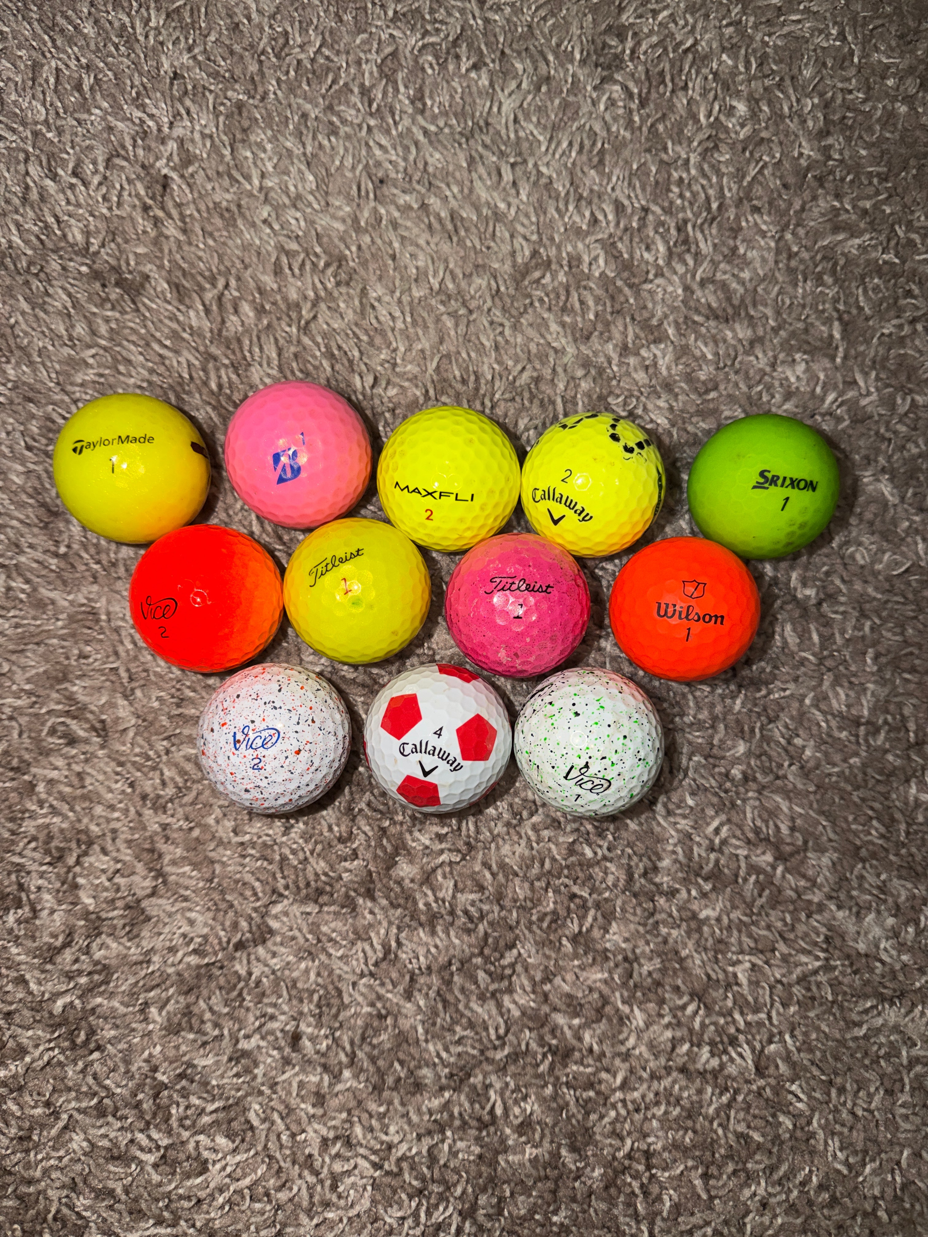 Dozen colored golf balls ￼