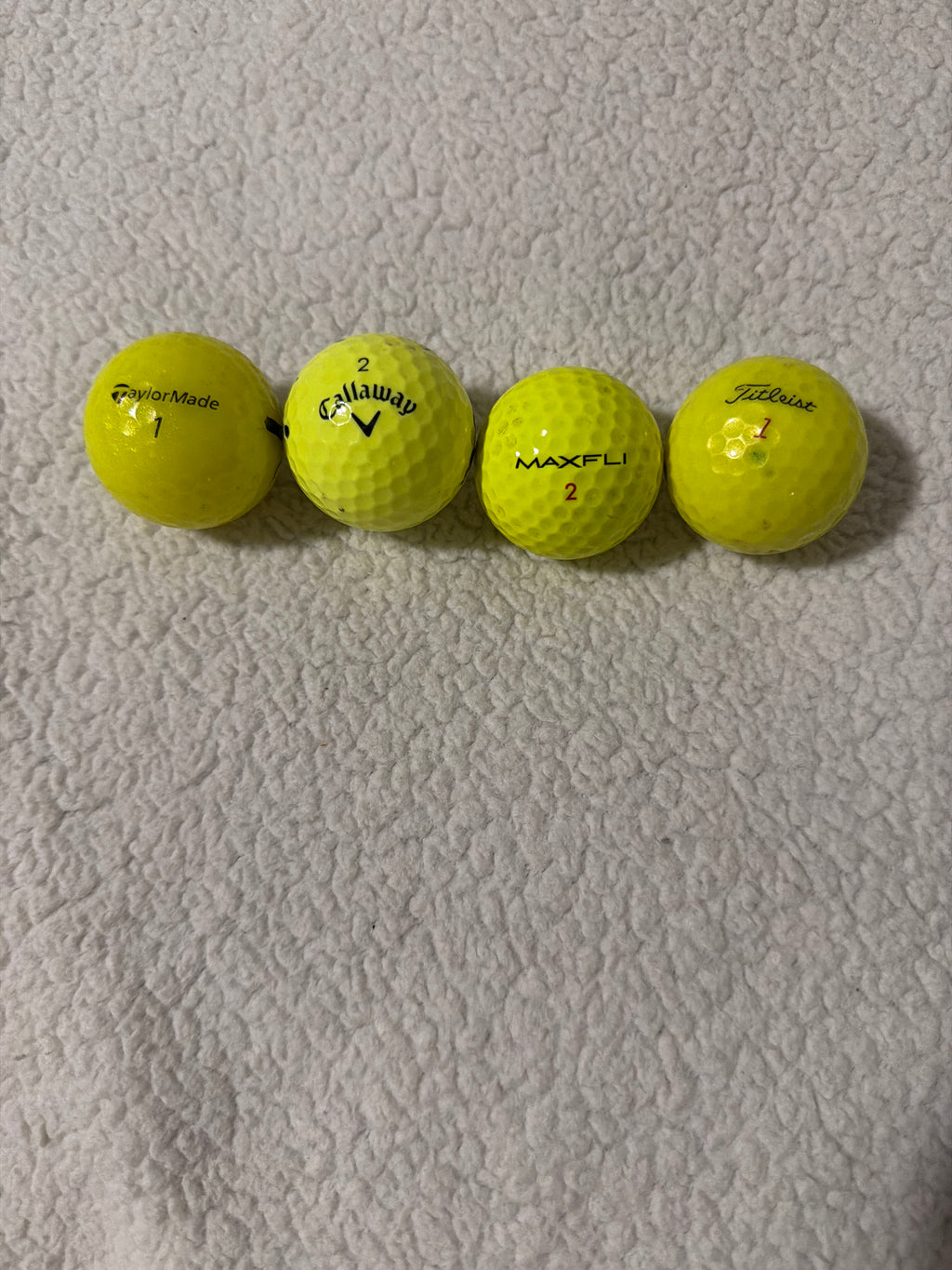 Dozen colored golf balls ￼