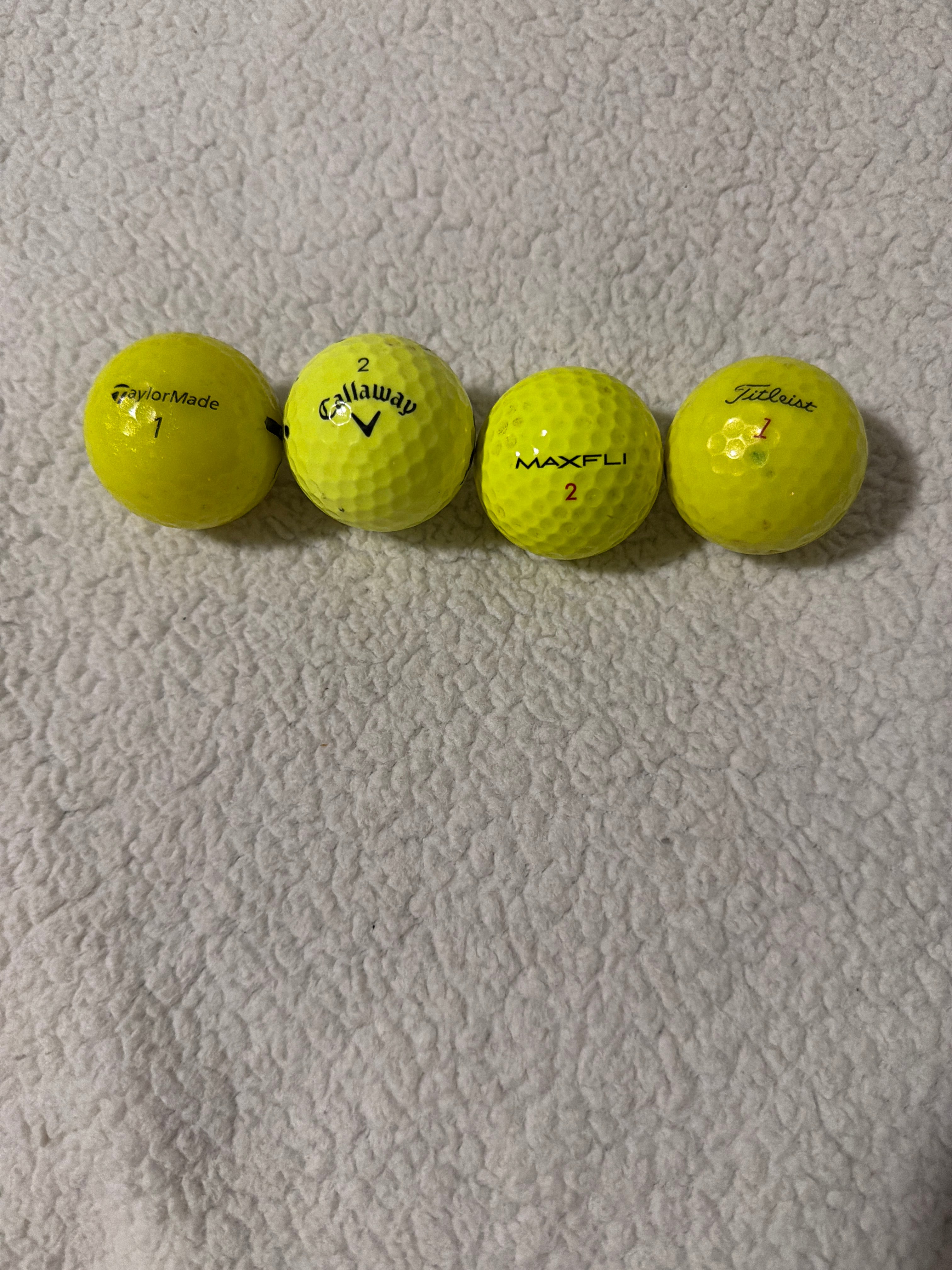 Dozen colored golf balls ￼