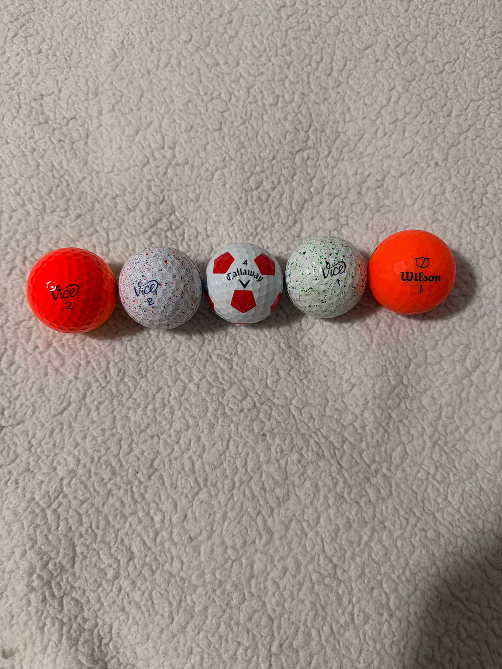 Dozen colored golf balls ￼